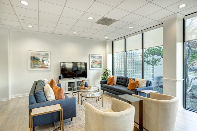 living room featuring floor to ceiling windows