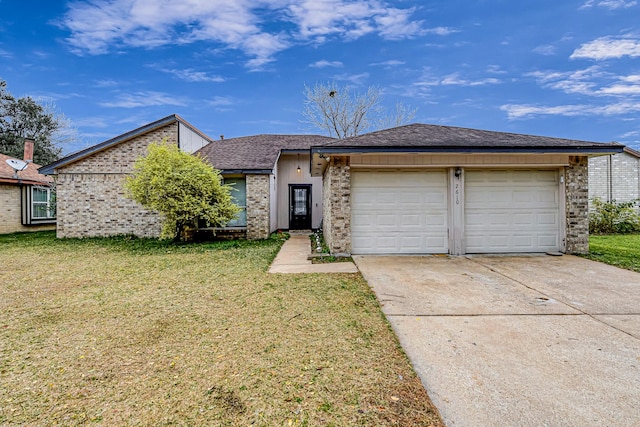 view of front of property with a garage and a front yard