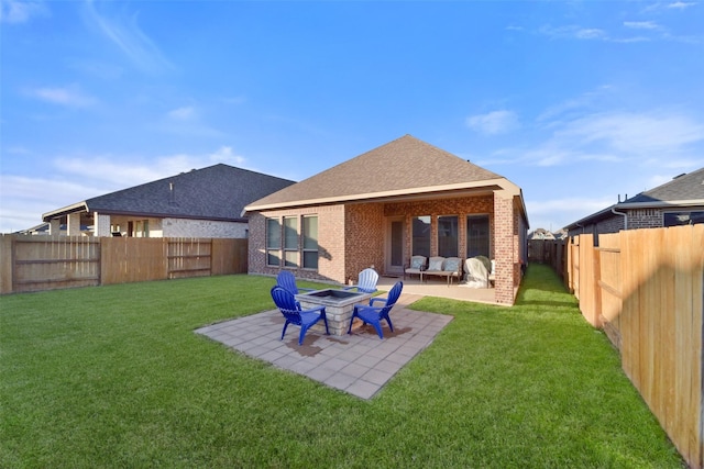 back of property featuring an outdoor fire pit, a patio area, and a yard