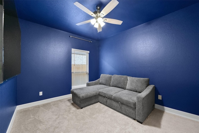 living room with light colored carpet and ceiling fan