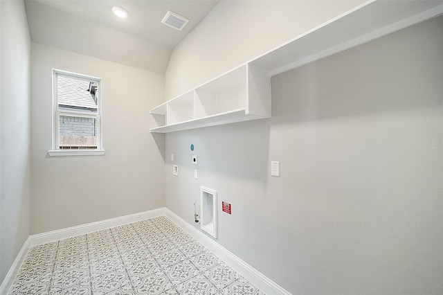 clothes washing area with hookup for a washing machine, gas dryer hookup, and electric dryer hookup