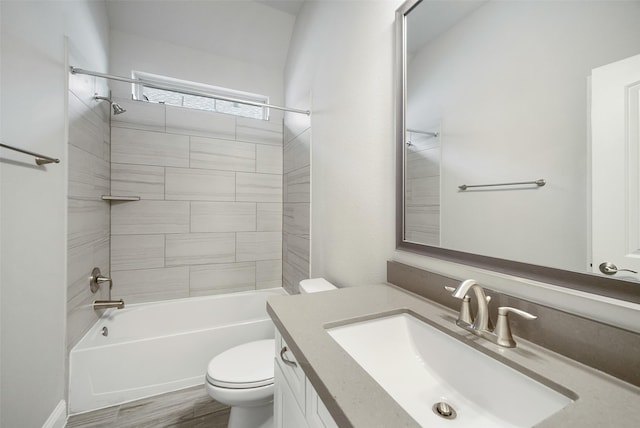 full bath featuring toilet, shower / tub combination, wood finished floors, and vanity