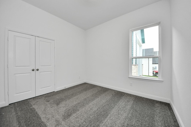 17733 Gold Saddle Ln, Magnolia, TX 77354 - unfurnished room with baseboards and dark colored carpet