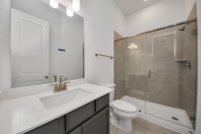 17733 Gold Saddle Ln, Magnolia, TX 77354 - bathroom featuring a shower stall, tile patterned flooring, vanity, and toilet