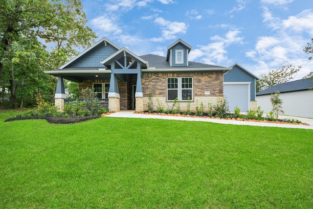 17733 Gold Saddle Ln, Magnolia, TX 77354 - craftsman-style home with a front lawn, a porch, an attached garage, and stone siding