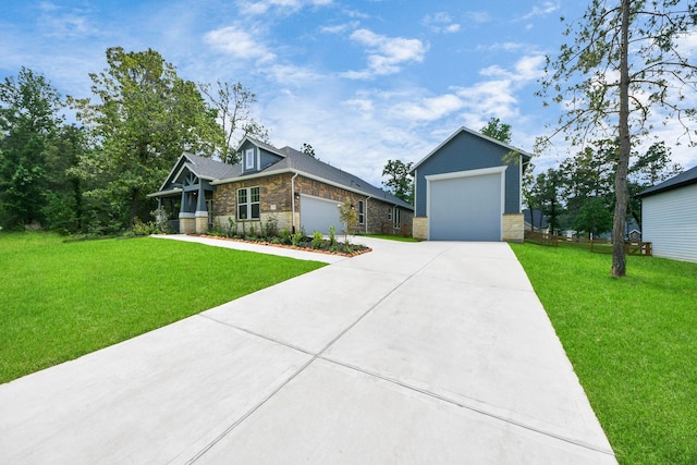 17733 Gold Saddle Ln, Magnolia, TX 77354 - view of front of house featuring driveway, stone siding, and a front yard