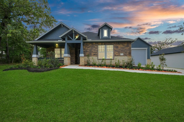 17733 Gold Saddle Ln, Magnolia, TX 77354 - craftsman house featuring a porch, a garage, stone siding, and a front yard