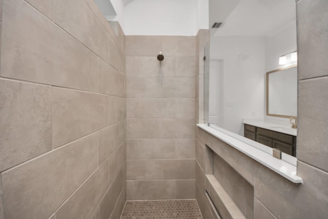 17733 Gold Saddle Ln, Magnolia, TX 77354 - bathroom featuring vanity, visible vents, and a tile shower