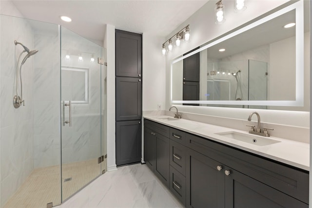 bathroom with vanity and a shower with shower door