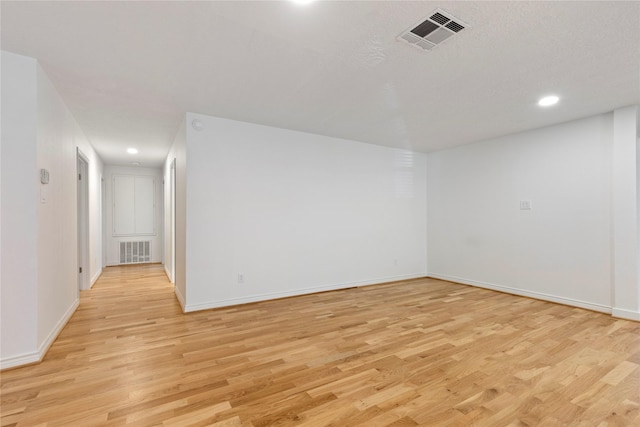 spare room with light wood-type flooring