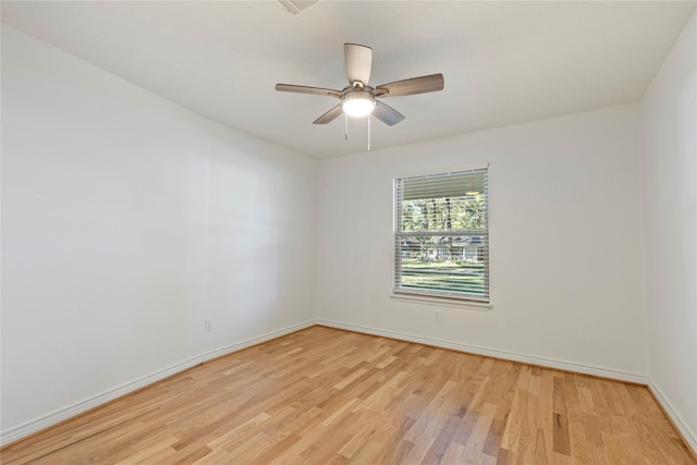 unfurnished room featuring light hardwood / wood-style flooring and ceiling fan