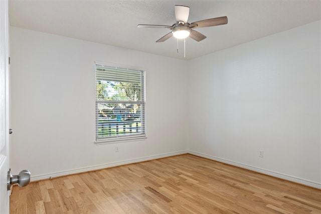 unfurnished room featuring ceiling fan and light wood-type flooring