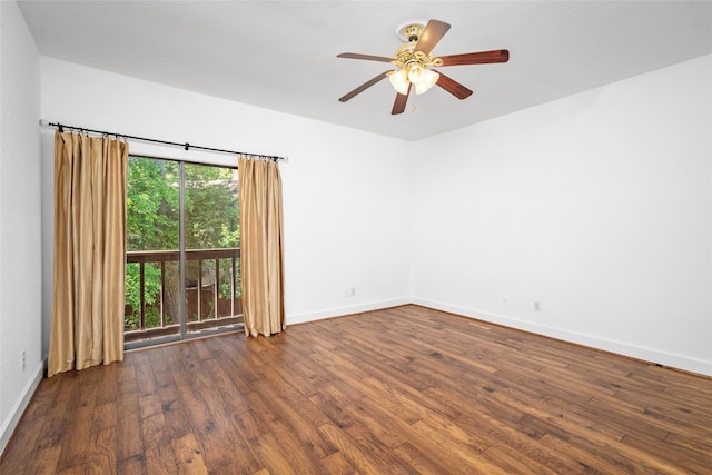 empty room with ceiling fan and dark wood-type flooring