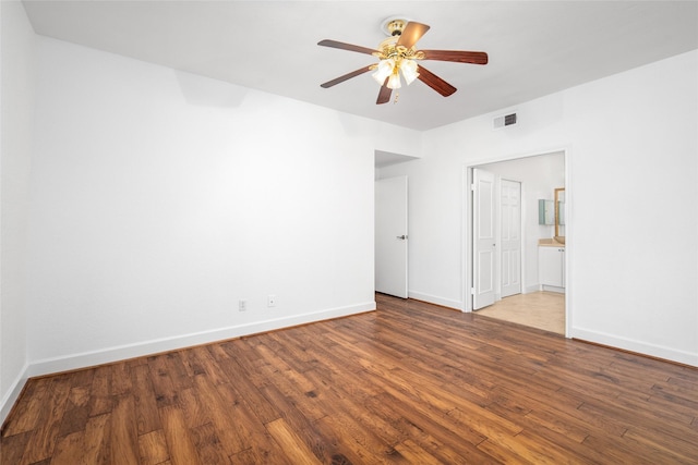 spare room with hardwood / wood-style flooring and ceiling fan