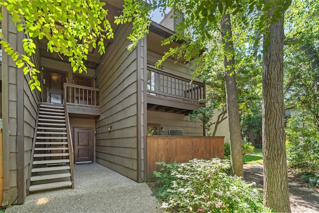 view of side of home featuring a balcony