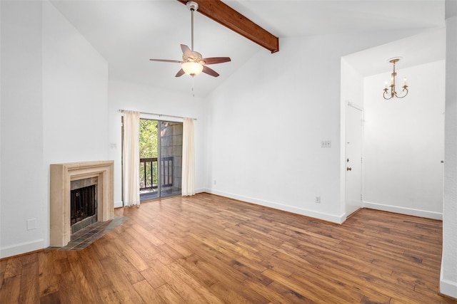 unfurnished living room featuring ceiling fan with notable chandelier, wood-type flooring, high vaulted ceiling, beamed ceiling, and a fireplace