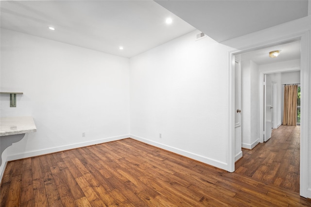 unfurnished room featuring dark hardwood / wood-style floors