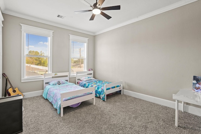 bedroom featuring carpet, ceiling fan, and crown molding