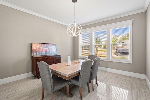 dining area with crown molding and a chandelier