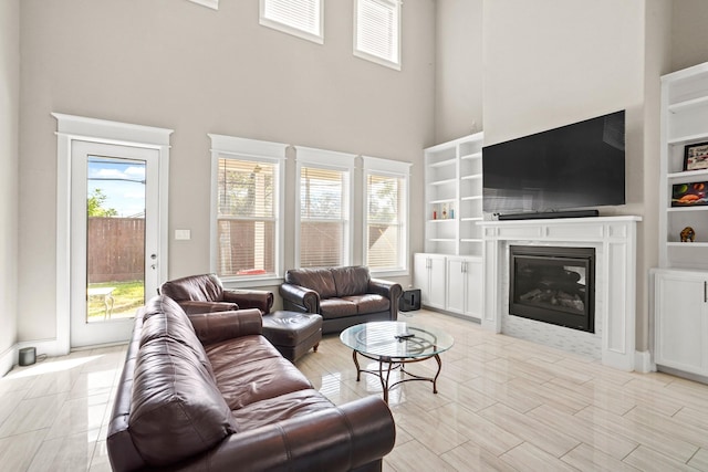 living room with a wealth of natural light and a high ceiling