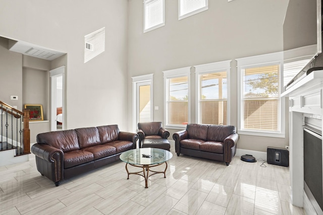 living room with a high ceiling