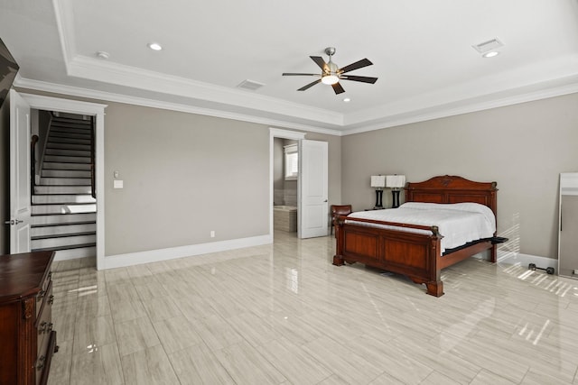 bedroom featuring a tray ceiling, ceiling fan, and ornamental molding