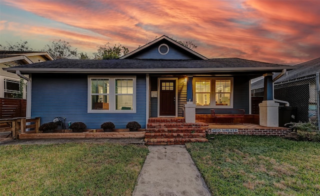 view of front of home with a yard