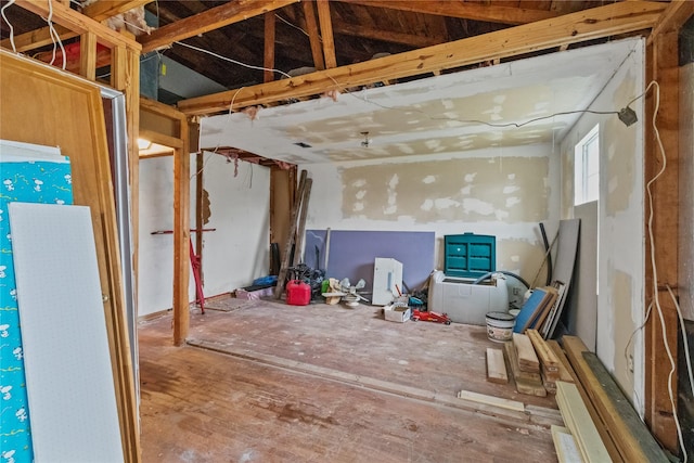 miscellaneous room featuring lofted ceiling