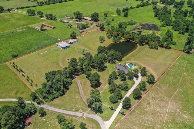 birds eye view of property with a water view and a rural view