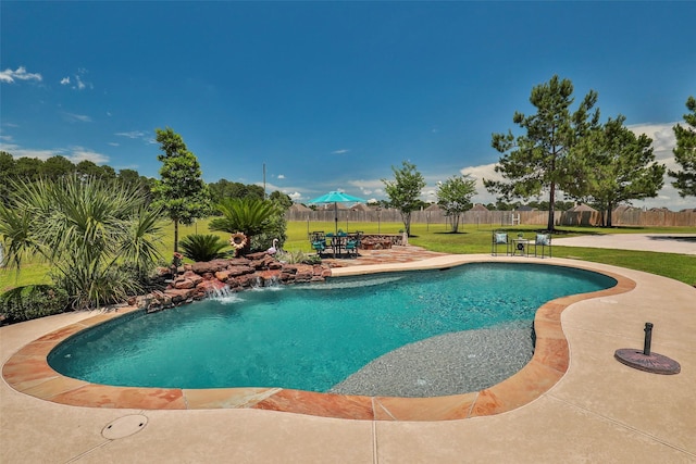 view of swimming pool featuring a patio area and a lawn