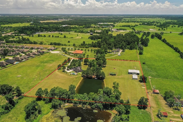 drone / aerial view with a water view and a rural view