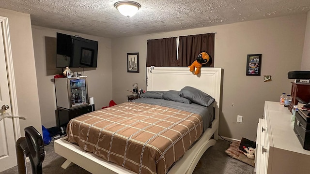 bedroom featuring a textured ceiling and carpet