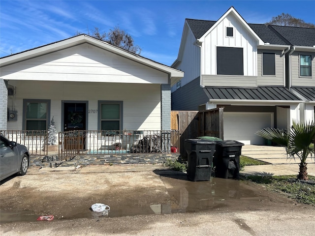 view of front of house with a porch and a garage