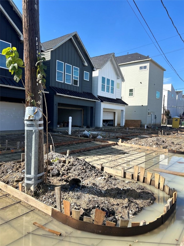 rear view of house with a garage