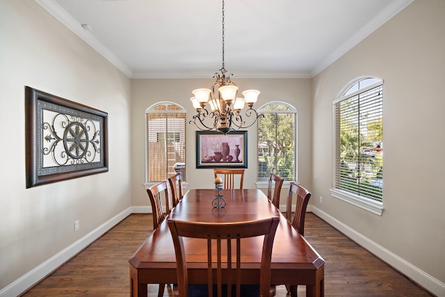 dining area featuring crown molding, dark hardwood / wood-style floors, and a notable chandelier