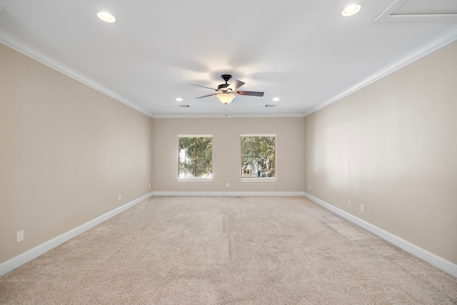 spare room with light colored carpet, ceiling fan, and crown molding