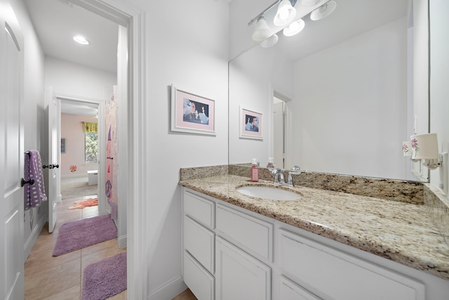 bathroom with tile patterned flooring and vanity