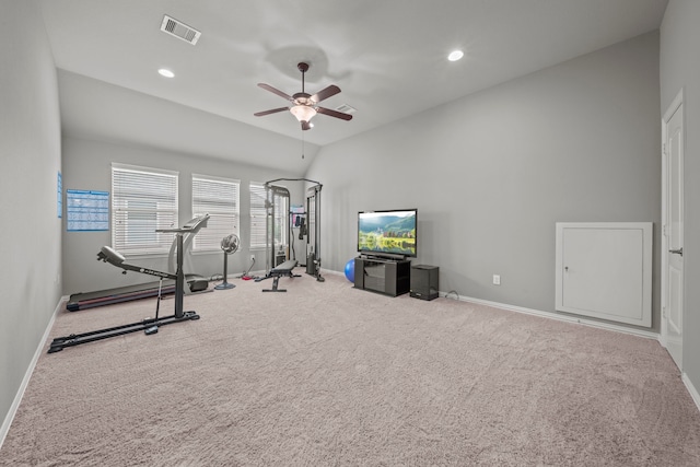 exercise area featuring ceiling fan, lofted ceiling, and carpet floors