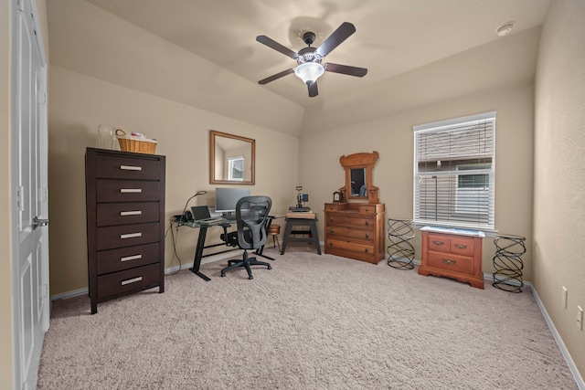 carpeted office space featuring ceiling fan and lofted ceiling