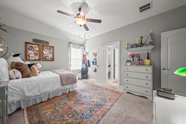 bedroom featuring ceiling fan and carpet