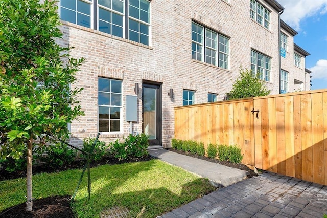 doorway to property featuring a yard