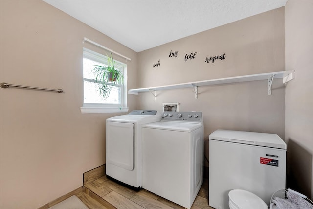 washroom with separate washer and dryer