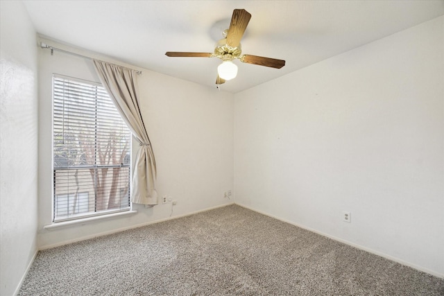 carpeted empty room with ceiling fan