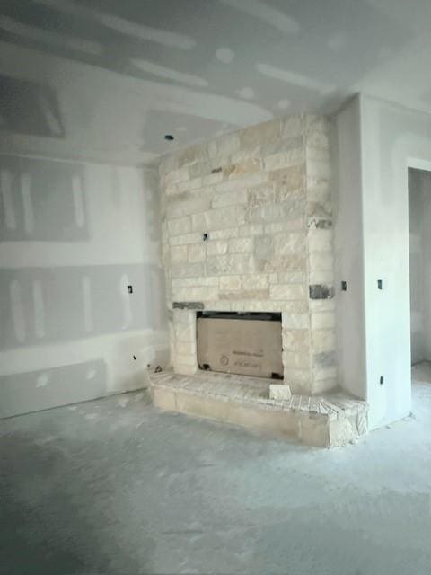 unfurnished living room with a fireplace