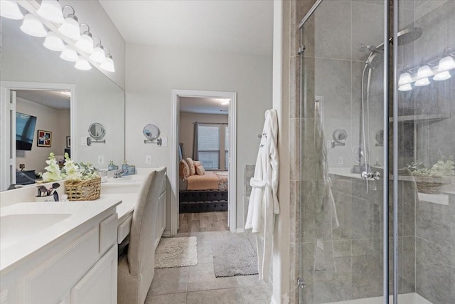 bathroom with vanity, walk in shower, and tile patterned flooring