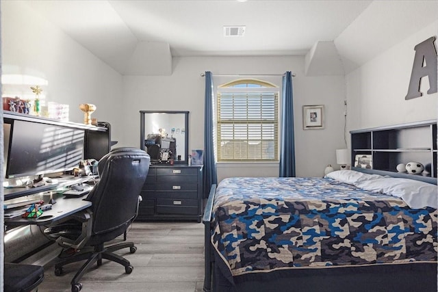 bedroom with light hardwood / wood-style flooring