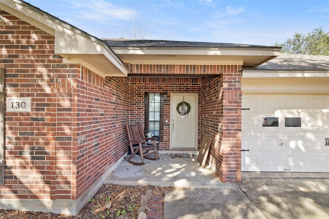 entrance to property featuring a garage