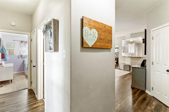 corridor featuring dark wood-type flooring