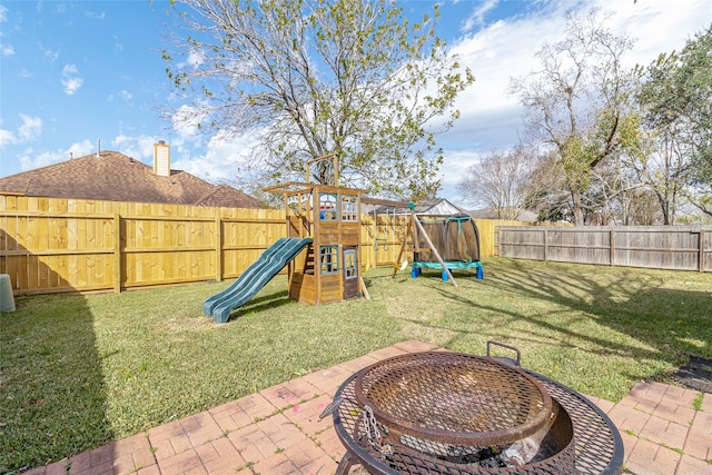 view of yard with a patio and a playground