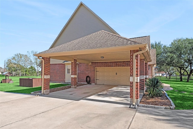 view of side of property with a lawn, a carport, and a garage